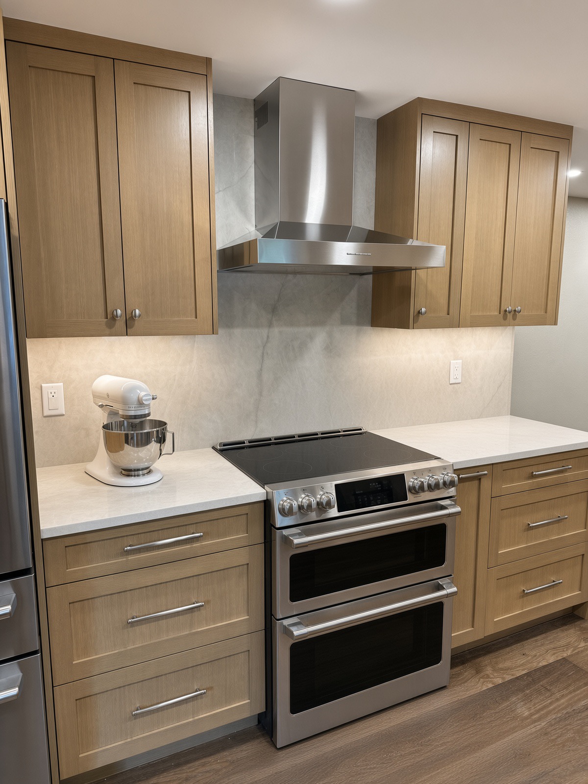 Double oven range, stainless steel hood and mixer in the Bothell kitchen